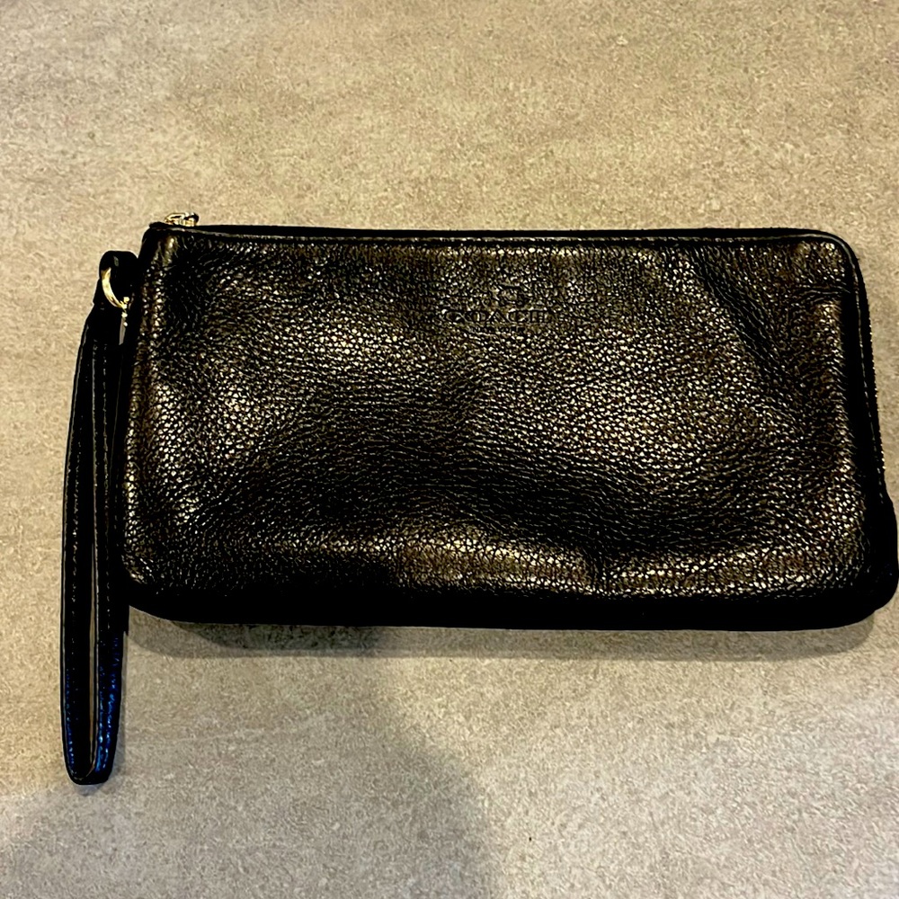Coach wristlet. Two zippered compartments. Pebbled leather. Like new.